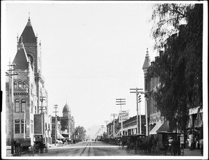 Street view in San Bernardino, California, includes courthouse, ca.1905