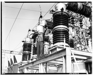 Man on the rigging of an electrical power plant