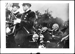 United States President Woodrow Wilson and French President Raymond Poincare riding in a carriage in Paris, ca.1918