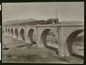 Train crossing over the Santa Ana River in Riverside, ca.1904