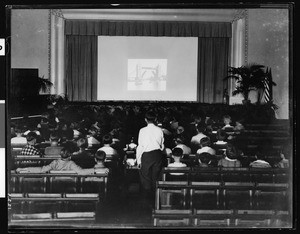 Slide show in the auditorium of Alexandria Avenue School