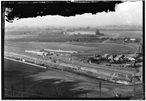 Birdseye view of a racetrack and DuBrock's Boarding Stable