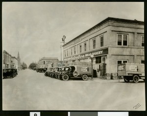 Sally Carr Bakery trucks lined up at the bakery in Pomona, ca.1920