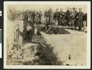 American soldiers gathering up dead Sioux Indians after the Wounded Knee Massacre in South Dakota, January 1, 1891