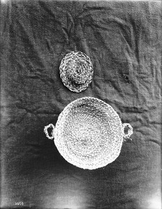 Two unidentified Indian baskets on display, ca.1900