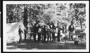 Boy Scouts dishing out food at a summer camp in Tahquitz Valley, ca.1930