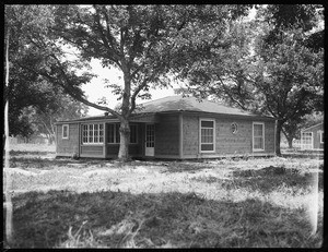 An exterior view of a one-story house