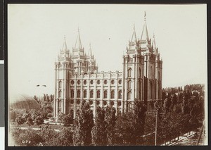 Exterior view of the Mormon Temple behind a thicket of trees, Salt Lake City, Utah