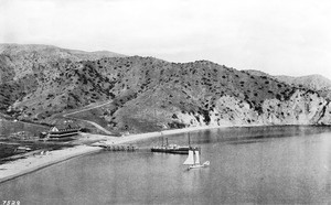 View of Avalon Bay looking south, showing a sail boat and departing Ferndale steamer, ca.1887