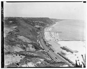 Birdseye view looking south at three piers along Pacific Coast Highway between Malibu and Santa Monica