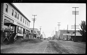 Unidentified street in Wilmington illustrating the raised buildings which assisted in keeping the buildings from being flooded by the backwater, ca.1925