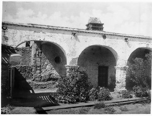 Ruins of the tile chimney and elliptical arches at Mission San Juan Capistrano, California, ca.1900