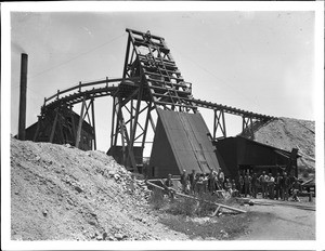 Group of men standing at the foot of the gallows at the Good Hope Mine, Riverside County, ca.1905