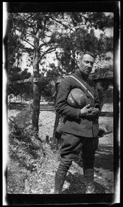 Soldier holding his helmet during World War I, ca.1916