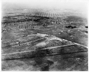 Aerial view of Wilshire Boulevard and Fairfax Avenue, showing Rogers Airport, 1920