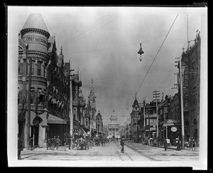 View looking north down an unidentified street in Fresno, showing the First National Bank building