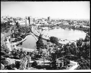 Birdseye view of Westlake (MacArthur) Park, showing high rise buildings and numerous palm trees