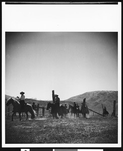 A group of people horseback riding at Hunewill's Circle H Dude Ranch, near Bridgeport, ca.1930