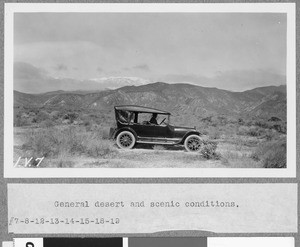 Automobile parked on a desert road, ca.1910
