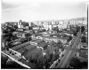 Birdseye view of buildings in Los Angeles, showing City Hall in the background at right