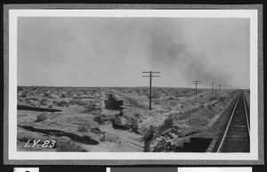 Railroad track on east side of the Salton Sea, showing a drainage system running diagonal to it, ca.1910