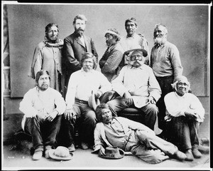 Portrait of Juan Largo and Jonathan Trumbull Warner with a group of mission Indians, Christmas 1875