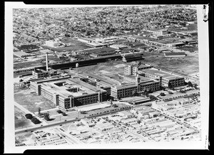 Birdseye view of the Goodyear Tire and Rubber Company factory, showing surrounding residential area, 1936