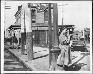 Woman at the junction of Spring Street and Main Street looking north, ca.1906