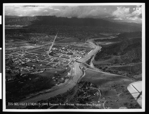 Aerial view of the flooded Los Angeles River at the Barham Boulevard bridge, 1938