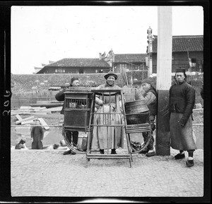 Rice vendor and three young men by the river docks in China, ca.1900