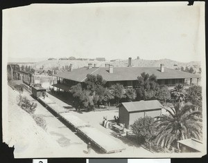 Birdseye view of the Southern Pacific Hotel and bridge, showing Fort Yuma Indiana School in the distance, Yuma, Arizona