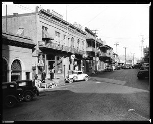 Unidentified street in Jackson, showing commercial shops, ca.1930