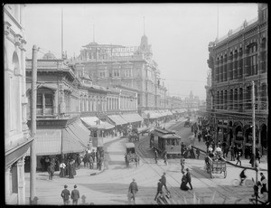 Hamburger's Department Store seen from down a very busy street, ca.1890-1899