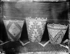 Three Indian baskets on display, ca.1900