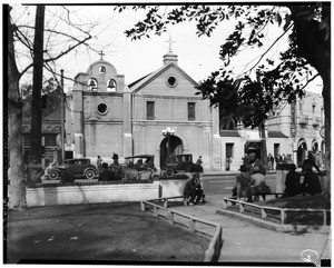 Automobiles parked in front of the Plaza Church, Los Angeles