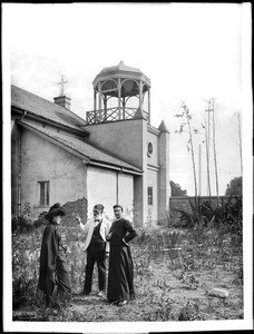 Don Antonio Coronel and Dona Marianna at the Plaza Church with Father Liebana, Los Angeles, ca.1890