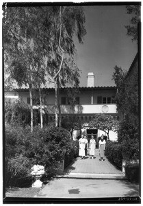 Portrait of four women standing in front of a building at Scripps College in Claremont, October 1935