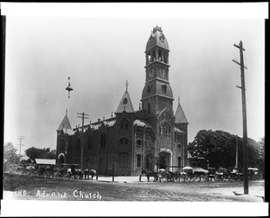 Exterior view of the Adventist Church in Fresno, showing carriages parked out front, 1905