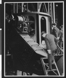Men in suits inspecting telescope apparata at the Mount Wilson observatory, ca.1930