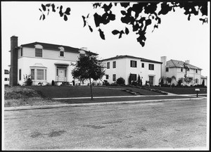 Row of Regency-style homes on an unidentified street in Los Angeles