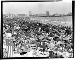 People relaxing under umbrellas at an unidentified beach