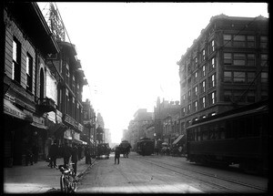 View of Main Street looking south toward Third Street in Los Angeles and showing several streetcars, ca.1909