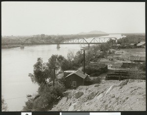 Bridge over the Colorado River, showing an industrial yard in the foreground in Yuma, Arizona