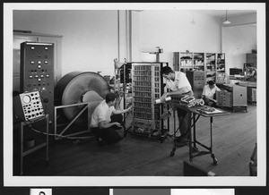 Interior of Logistics Research with workers, ca.1950