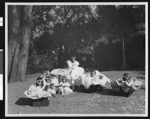 Girls in costumes with ruffles and flowers, ca.1920