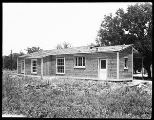 An exterior view of what appears to be the back of a California Ranch style house