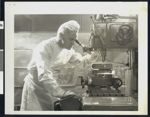 Lab technician using an Autonetics jig bore