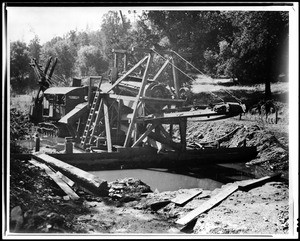 Dredging machine installed in a shallow stream in Plymouth, ca.1932