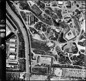 Aerial view of Century City showing a wide road and many buildings, May 6, 1959