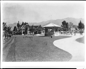 Exterior view of the Pasadena Public Library and an adjacent park, ca.1908